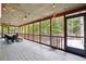 Spacious screened porch with dining area and wooded views at 1199 Old Lathemtown Rd, Canton, GA 30115