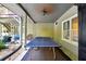 Covered patio with ping pong table and outdoor grill at 1199 Old Lathemtown Rd, Canton, GA 30115