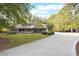 House exterior with a three-car garage and large driveway at 1199 Old Lathemtown Rd, Canton, GA 30115