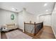 Spacious upper hallway with unique seating and hardwood floors at 1199 Old Lathemtown Rd, Canton, GA 30115
