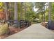 Long driveway leading to a charming house nestled in trees at 1199 Old Lathemtown Rd, Canton, GA 30115