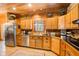 Kitchen boasts wood cabinets, stainless steel appliances, and ample counter space at 1785 Whitley Rd, Dacula, GA 30019