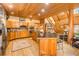Open concept kitchen with island and wood cabinets at 1785 Whitley Rd, Dacula, GA 30019