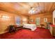 Bedroom with wood-paneled walls and carpeted floors at 1785 Whitley Rd, Dacula, GA 30019
