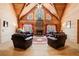 Spacious living room with a stone fireplace and hardwood floors at 1785 Whitley Rd, Dacula, GA 30019