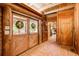 Wood paneled entry with tile floors and double doors at 1785 Whitley Rd, Dacula, GA 30019