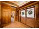 Entryway with wood-paneled walls and double doors at 1785 Whitley Rd, Dacula, GA 30019