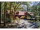 Stunning two-story home with a metal roof and a covered porch at 1785 Whitley Rd, Dacula, GA 30019