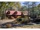 Ranch style home with red metal roof and stone accents at 1785 Whitley Rd, Dacula, GA 30019