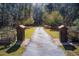 Long driveway entrance to a house through wooded area at 1785 Whitley Rd, Dacula, GA 30019
