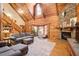 Cozy living room with stone fireplace and vaulted wood ceilings at 1785 Whitley Rd, Dacula, GA 30019