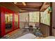 Covered deck with red doors and wooded views at 1785 Whitley Rd, Dacula, GA 30019