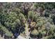 Aerial view showing home's location within a wooded lot at 1785 Whitley Rd, Dacula, GA 30019
