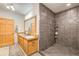 Basement bathroom with double vanity and large walk-in shower at 1785 Whitley Rd, Dacula, GA 30019