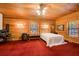 Bedroom with wood-paneled walls and carpeted floors at 1785 Whitley Rd, Dacula, GA 30019