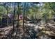 Long driveway leading to a beautiful home nestled in the woods at 1785 Whitley Rd, Dacula, GA 30019