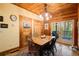 Rustic dining area with wood table and chairs, access to deck at 1785 Whitley Rd, Dacula, GA 30019