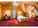 Large bedroom with a wooden ceiling, double bed, and a desk at 1785 Whitley Rd, Dacula, GA 30019