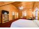 Main bedroom with wooden walls, large bed, and built-in shelving at 1785 Whitley Rd, Dacula, GA 30019