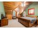 Main bedroom with wood-paneled walls and large windows at 1785 Whitley Rd, Dacula, GA 30019