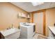 Convenient laundry room with washer, dryer, and utility sink at 1785 Whitley Rd, Dacula, GA 30019