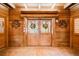 Inviting entryway with double doors and wood-paneled walls at 1785 Whitley Rd, Dacula, GA 30019