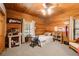 Charming bedroom with wood walls and a comfortable bed at 1785 Whitley Rd, Dacula, GA 30019
