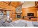 Cozy living room with stone fireplace and hardwood floors at 1785 Whitley Rd, Dacula, GA 30019