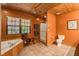 Bathroom with tile floor, soaking tub and shower at 1785 Whitley Rd, Dacula, GA 30019