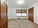 Bedroom with closet, windows, and carpeted flooring at 2731 River Rd, Ellenwood, GA 30294