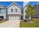 Two story home with gray siding and stone accents at 376 Lakeside Ct, Canton, GA 30114