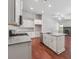 Modern kitchen with white cabinets, granite counters and island at 376 Lakeside Ct, Canton, GA 30114