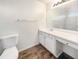 Bathroom with vanity, mirror and wood-look vinyl floor at 2575 Walden Lake Dr, Decatur, GA 30035