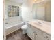 Bathroom with tub, vanity, and wood-look vinyl floor at 2575 Walden Lake Dr, Decatur, GA 30035