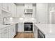 Modern kitchen with white cabinets, stainless steel appliances, and quartz countertops at 1321 Parc Bench Rd, Atlanta, GA 30316