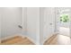 Light and airy hallway with hardwood floors and closet at 1321 Parc Bench Rd, Atlanta, GA 30316