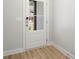 Light and airy entryway with hardwood floors and white door at 1321 Parc Bench Rd, Atlanta, GA 30316