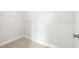Walk-in closet with carpet flooring and hanging rod at 1321 Parc Bench Rd, Atlanta, GA 30316