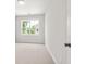 Bright bedroom with neutral walls, carpet, and a window offering natural light at 1321 Parc Bench Rd, Atlanta, GA 30316