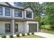 Two-story townhome with attached garage and modern exterior at 1321 Parc Bench Rd, Atlanta, GA 30316