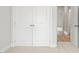 Double door closet with light neutral carpeting at 1321 Parc Bench Rd, Atlanta, GA 30316