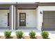 Modern townhome entry with dark gray door and white brick at 1321 Parc Bench Rd, Atlanta, GA 30316