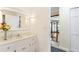 Clean bathroom with white vanity and a view of the living room at 599 Palmer Se Ct, Conyers, GA 30094