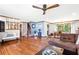 Spacious living room with hardwood floors, large windows and sectional sofa at 599 Palmer Se Ct, Conyers, GA 30094