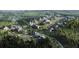 Aerial view of a luxury community with many homes, trees and open green spaces at 6024 Diamond Ln, South Fulton, GA 30213
