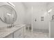 Modern bathroom with a large walk-in shower and marble vanity at 4571 Columns Se Dr, Marietta, GA 30067