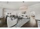 Open living area with hardwood floors, comfortable seating and large windows at 4571 Columns Se Dr, Marietta, GA 30067