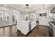 Spacious kitchen with marble countertops, stainless steel appliances, and white cabinetry at 4571 Columns Se Dr, Marietta, GA 30067