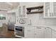 Bright kitchen with white cabinets, built-in oven, and marble countertops at 4571 Columns Se Dr, Marietta, GA 30067