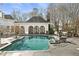 Inviting pool with fountain and outdoor entertaining area at 4571 Columns Se Dr, Marietta, GA 30067